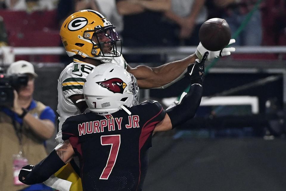 Randall Cobb of the Green Bay Packers catches a pass for a touchdown around Byron Murphy of the Arizona Cardinals during an Oct. 28, 2021, game in Glendale, Arizona.