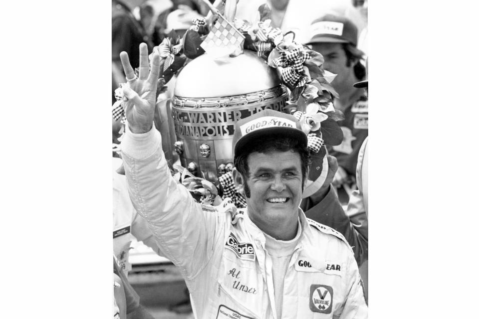 FILE - Formula 1 race car driver Al Unser waves three fingers in Victory Lane at Indianapolis Motor Speedway after winning the 62nd Indianapolis 500 in Indianapolis, Ind., on May 28, 1978. Al Unser, one of only four drivers to win the Indianapolis 500 a record four times, died Thursday following years of health issues. He was 82. (AP Photo, File)
