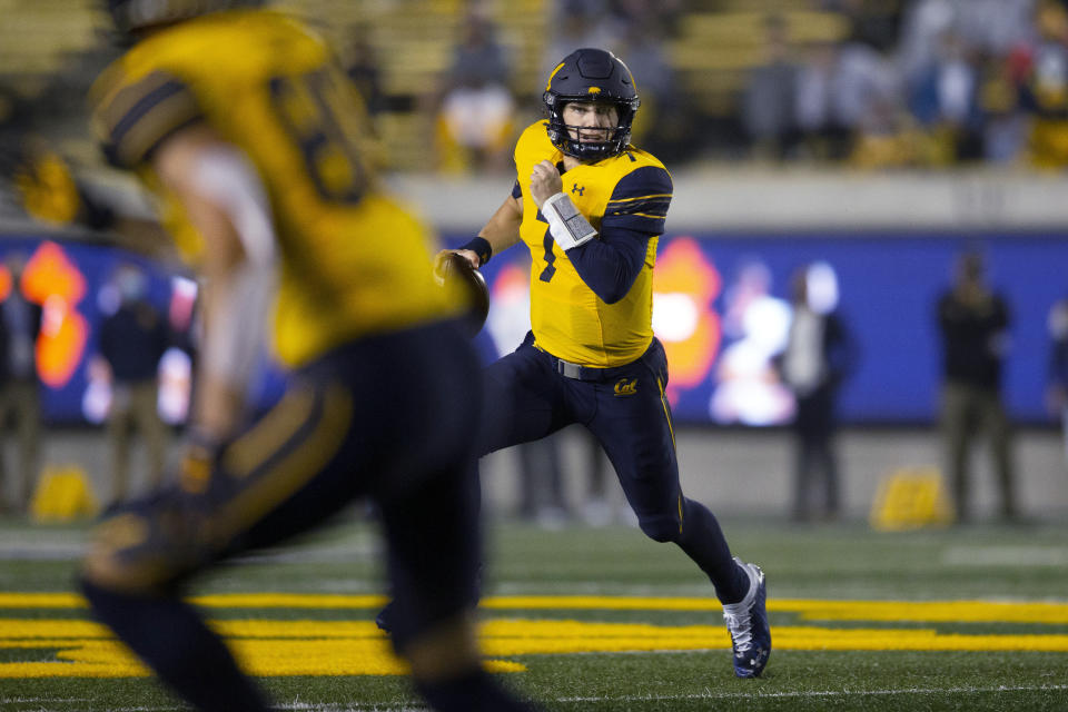 California quarterback Chase Garbers (7) run out of the pocket during the first quarter of the team's NCAA college football game against Nevada, Saturday, Sept. 4, 2021, in Berkeley, Calif. (AP Photo/D. Ross Cameron)