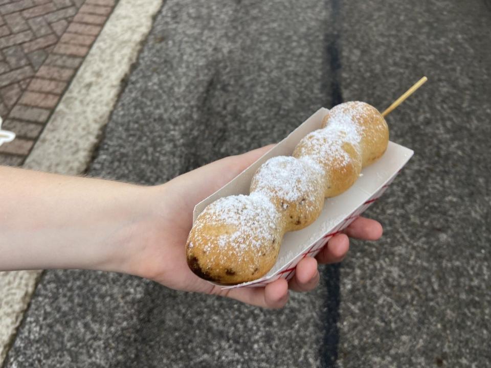 Waffle Bombs are chocolate-covered strawberries on a stick that are dipped in waffle batter and deep-fried.