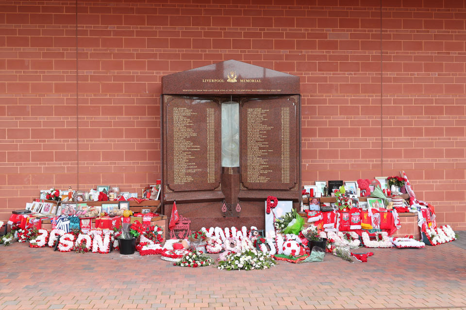 <p>Flowers and tributes left at the Hillsborough Memorial outside Anfield stadium, Liverpool, following the collapse of the Hillsborough trial. Picture date: Wednesday May 26, 2021. The judge at the Nightingale Court held at the Lowry in Salford, Greater Manchester, has ruled there is no case to answer in the trial of two retired police officers, Alan Foster and Donald Denton, and retired solicitor Peter Metcalf, who were all accused of perverting the course of justice following the Hillsborough disaster on April 15, 1989.</p>
