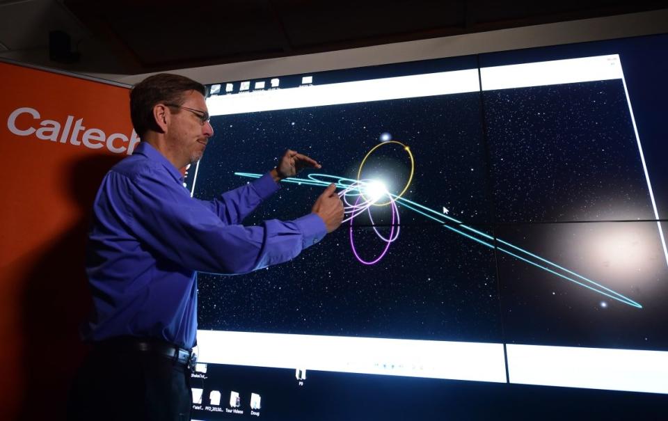 <div class="inline-image__caption"><p>Caltech astronomer Mike Brown briefs the media about a potential ninth planet.</p></div> <div class="inline-image__credit">AFP via Getty</div>