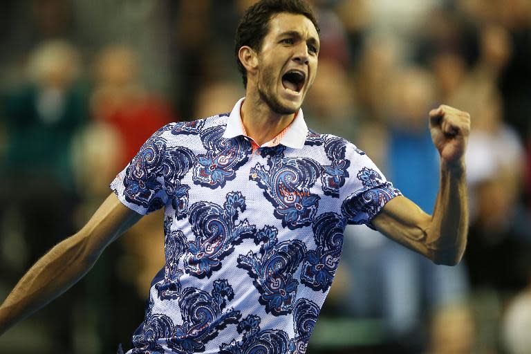 Great Britain's James Ward celebrates a point as he plays a Davis Cup World Group first-round singles tennis match against John Isner in Glasgow, Scotland, on March 6, 2015