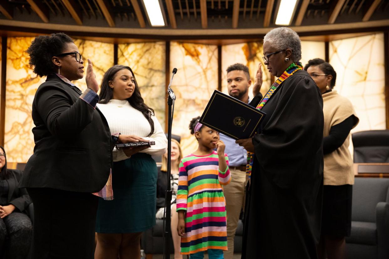 A Minnesota county’s first black commissioner Angela Conley took her oath of office with a book titled “The New Jim Crow.” (Credit: Angela Conley – Hennepin County Commissioner District 4/Facebook)