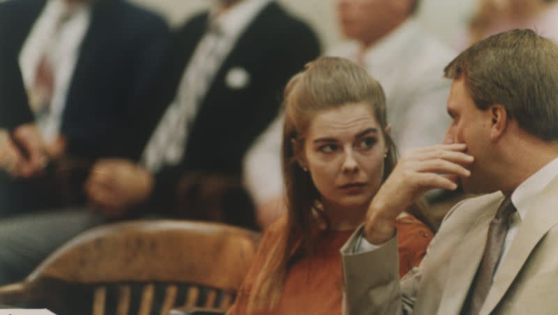 Elizabeth Haysom, left, talks to her lawyer Drew Davis after entering a plea of guilty on two counts of being an accessory before the fact of the murders of her two parents, in the Bedford County Circuit Court in Bedford, Va., on Aug. 24, 1987.