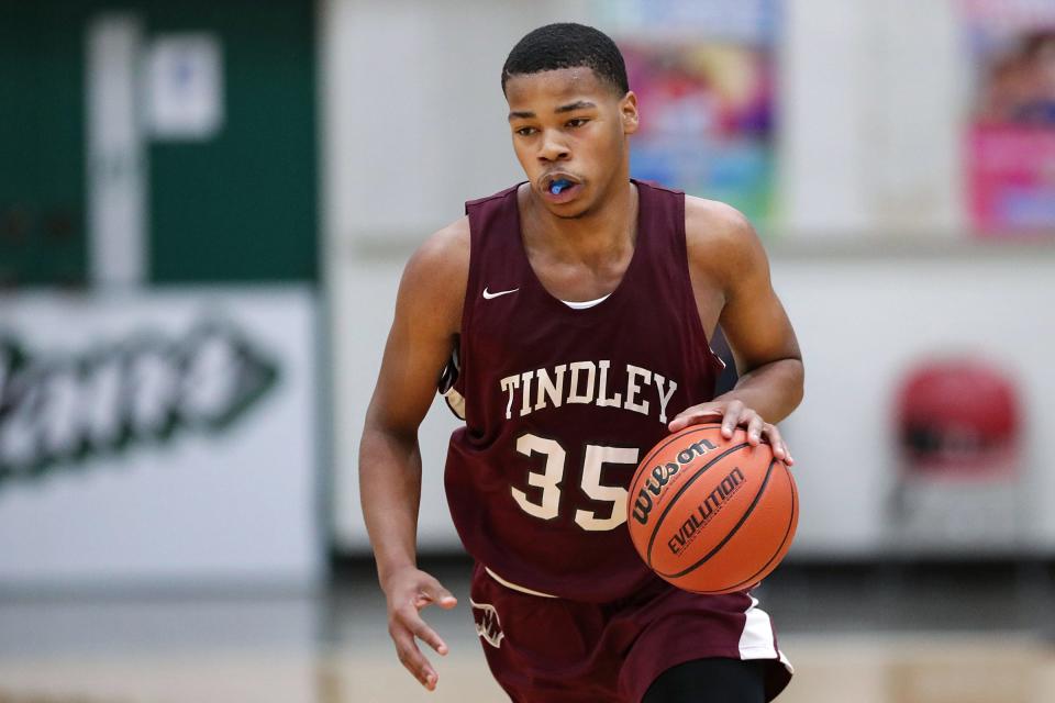 Tindley's Aaron Humphrey Jr. (35) works a possession during the second half of City tournament semifinals Saturday, Jan. 23, 2021, at Arsenal Technical High School in Indianapolis. Cathedral defeated Tindley, 85-64. 