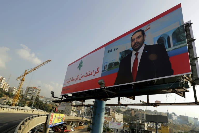 A poster of Lebanese Prime Minister Saad Hariri that reads "Your dignity is Lebanon's dignity" is seen on the highway north of Beirut on November 14, 2017
