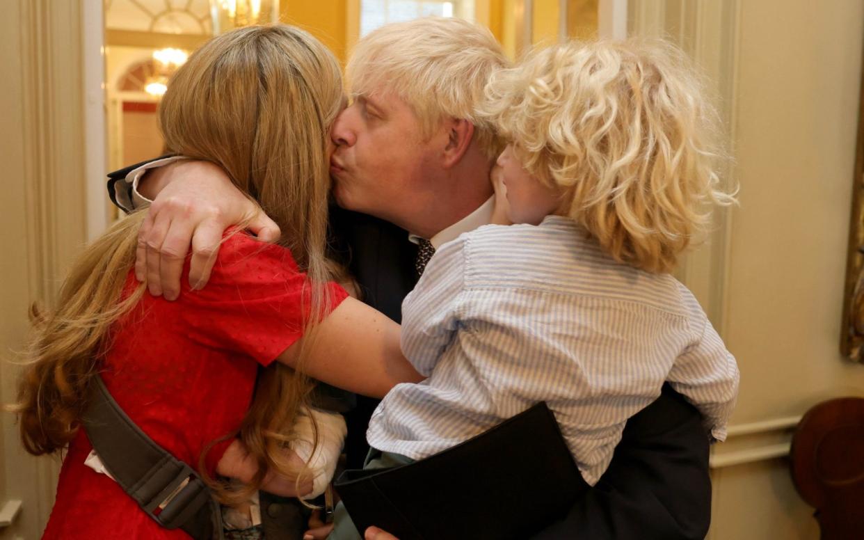 The Prime Minster is comforted by his wife, Carrie, and son, Wilfred, after giving his resignation speech - Andrew Parsons / No10 Downing Street