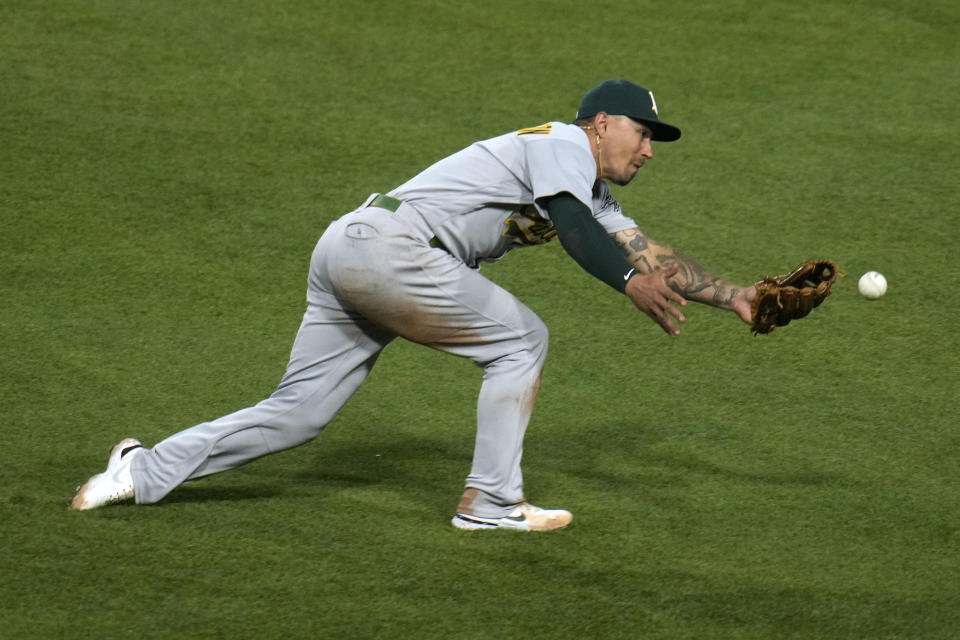 Oakland Athletics second baseman Jace Peterson cannot catch up to a ball hit into shallow right field for a double by Pittsburgh Pirates' Connor Joe, driving in a run, during the fifth inning of a baseball game in Pittsburgh, Monday, June 5, 2023. (AP Photo/Gene J. Puskar)