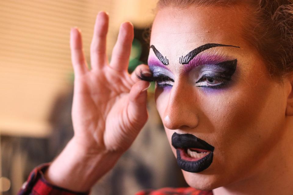 Sofonda Coxx Mornett applies a pair of fake eyelashes while getting ready at her home in Springfield Wednesday, Feb. 9, 2022. Mornett, the drag queen of Joe Schultz, 23, began performing in 2018 at Martha's Vineyard with Missouri State University Dance Company, an organization made up of student dancers. Mornett describes her drag persona as funny and campy.