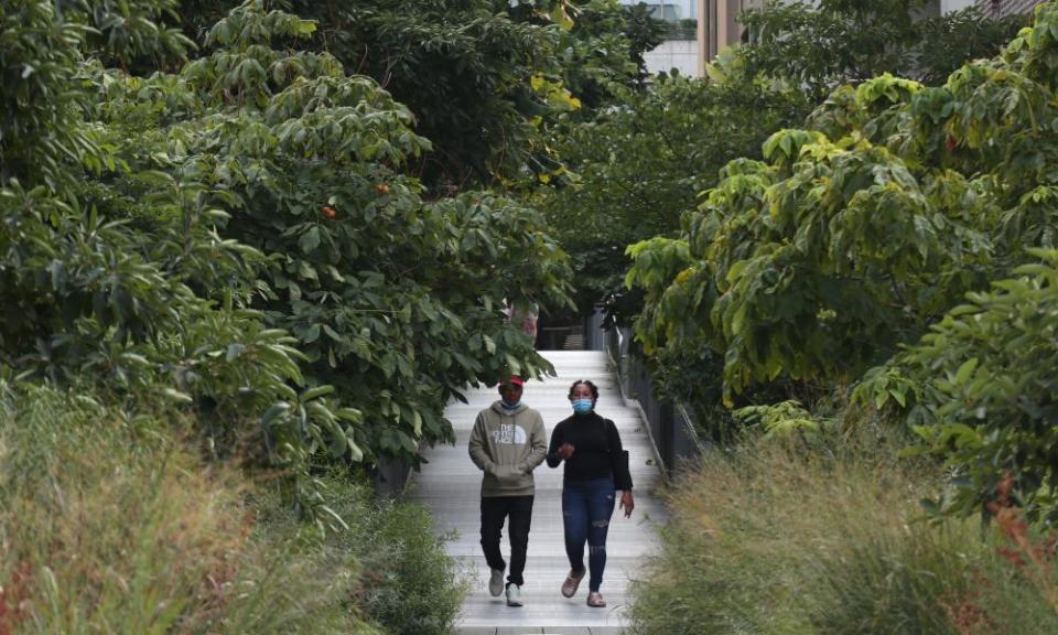 two people walk on New York's High Line