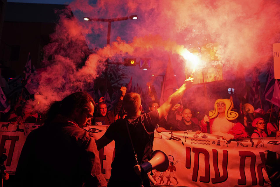 Israelis protest against plans by Prime Minister Benjamin Netanyahu's government to overhaul the judicial system, in Tel Aviv, Israel, Saturday, April 8, 2023. (AP Photo/Ariel Schalit)