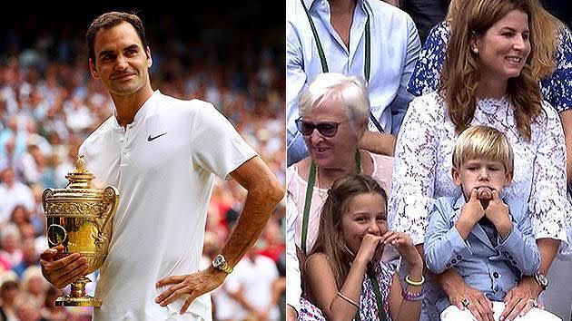 Federer with his eighth title as his son pulls faces. Pic: Getty