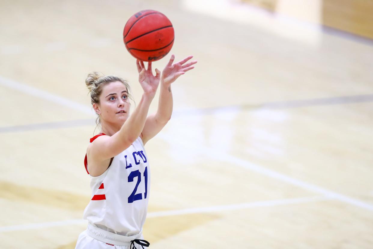 Lubbock Christian University guard Allie Schulte (21) shoots a free throw against West Texas A&M on Thursday, Feb. 25, 2021, at the Rip Griffin Center in Lubbock, Texas.