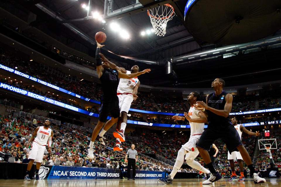 PITTSBURGH, PA - MARCH 17: Rodney McGruder #22 of the Kansas State Wildcats drives for a shot attempt in the second half against Rakeem Christmas #25 of the Syracuse Orange during the third round of the 2012 NCAA Men's Basketball Tournament at Consol Energy Center on March 17, 2012 in Pittsburgh, Pennsylvania. (Photo by Gregory Shamus/Getty Images)