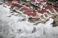 <p>Few of the homes that remained intact in the aftermath of Hurricane Irma, in St. Maarten. Irma cut a path of devastation across the northern Caribbean, leaving thousands homeless after destroying buildings and uprooting trees, Sept. 6, 2017. (Photo: Gerben Van Es/Dutch Defense Ministry via AP) </p>