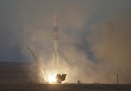 The Soyuz-FG rocket booster with Soyuz MS-11 space ship carrying a new crew to the International Space Station, ISS, blasts off at the Russian leased Baikonur cosmodrome, Kazakhstan, Monday, Dec. 3, 2018. The Russian rocket carries U.S. astronaut Anne McClain, Russian cosmonaut Oleg Kononenko‎ and CSA astronaut David Saint Jacques. (AP Photo/Dmitri Lovetsky)