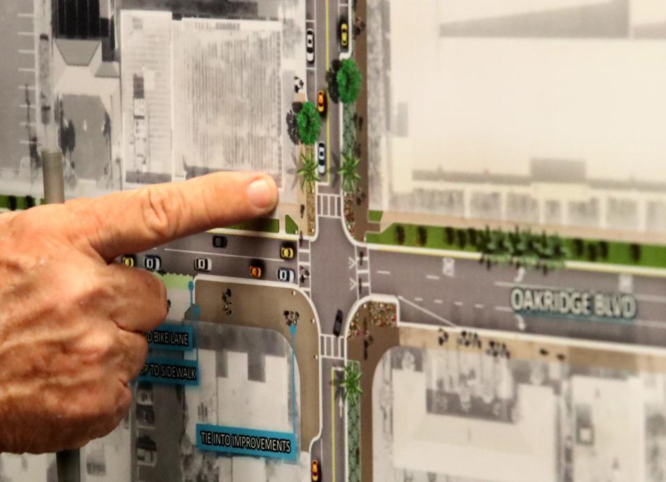 Residents look at maps that show some conceptual plans for beachside roads at the Ocean Center in Daytona Beach on Wednesday. No funding has been earmarked for the plans shown Wednesday.