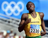 <p>Jamaica’s Usain Bolt runs in a men’s 200 meter qualifying heat at the Olympic Stadium during the 2004 Olympic Games. (AP) </p>
