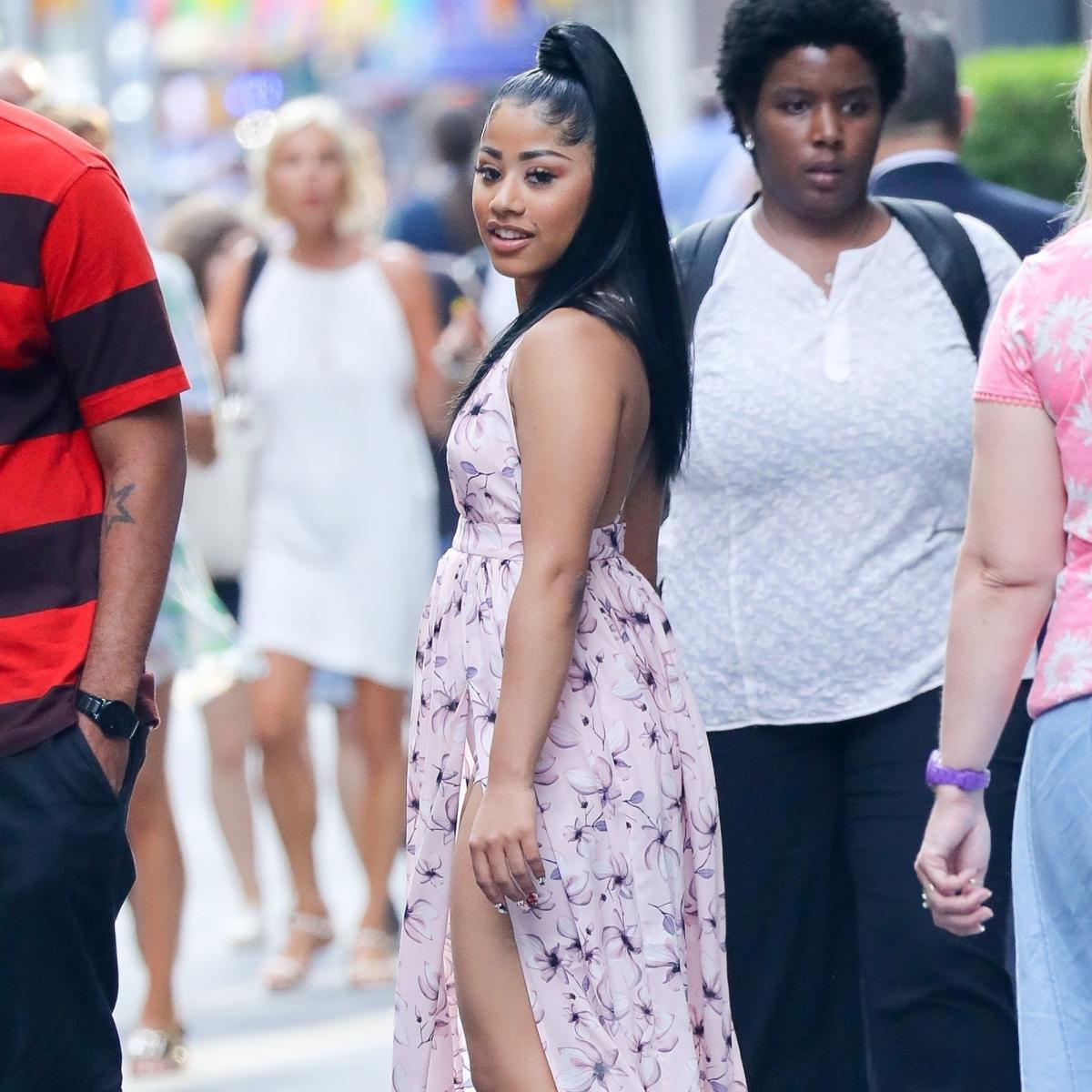 Cardi B: White Turtleneck, Checked Skirt