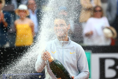 Tennis - ATP World Tour Masters 1000 - Italian Open - Foro Italico, Rome, Italy - May 20, 2018 Spain's Rafael Nadal celebrates with champagne after winning the final against Germany's Alexander Zverev REUTERS/Tony Gentile
