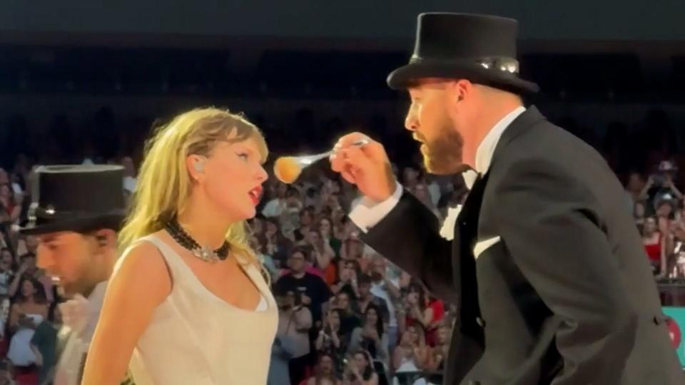 The tight end appeared in a suit and top hat surprising 89,000 Taylor Swift fans at Wembley Stadium.