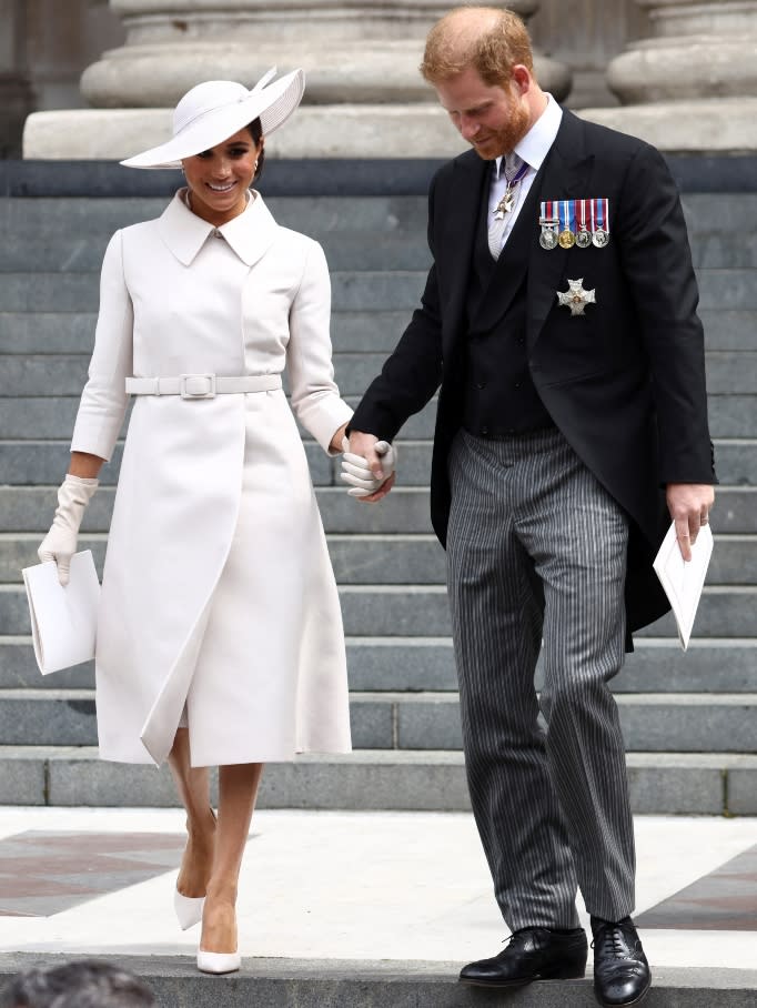 Prince Harry, Duke of Sussex and Meghan, Duchess of Sussex hold hands as they depart after the National Service of Thanksgiving to Celebrate the Platinum Jubilee of Her Majesty The Queen at St Paul's Cathedral on June 3, 2022 in London, England. 