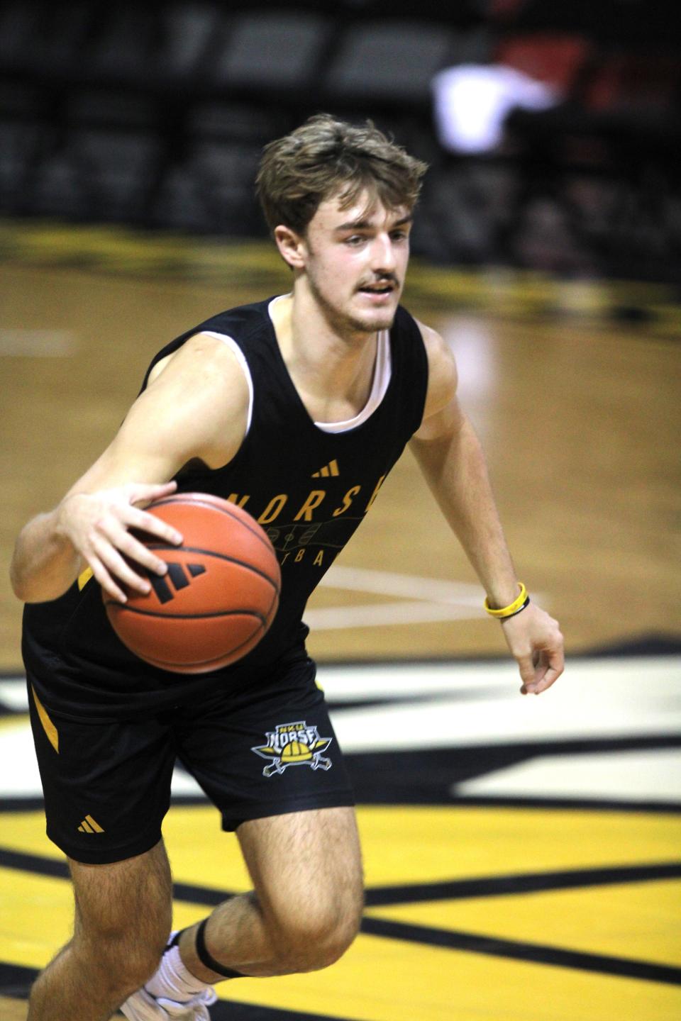 NKU junior guard Sam Vinson dribbles in practice as Northern Kentucky University men's basketball team had preseason practice Oct. 26, 2023, at Truist Arena.