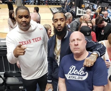 Nipsey Hussle poses with Bobby Francis and former manager Steve Lobel last Saturday at the Texas Tech-Gonzaga Elite Eight game. (via Bobby Francis)