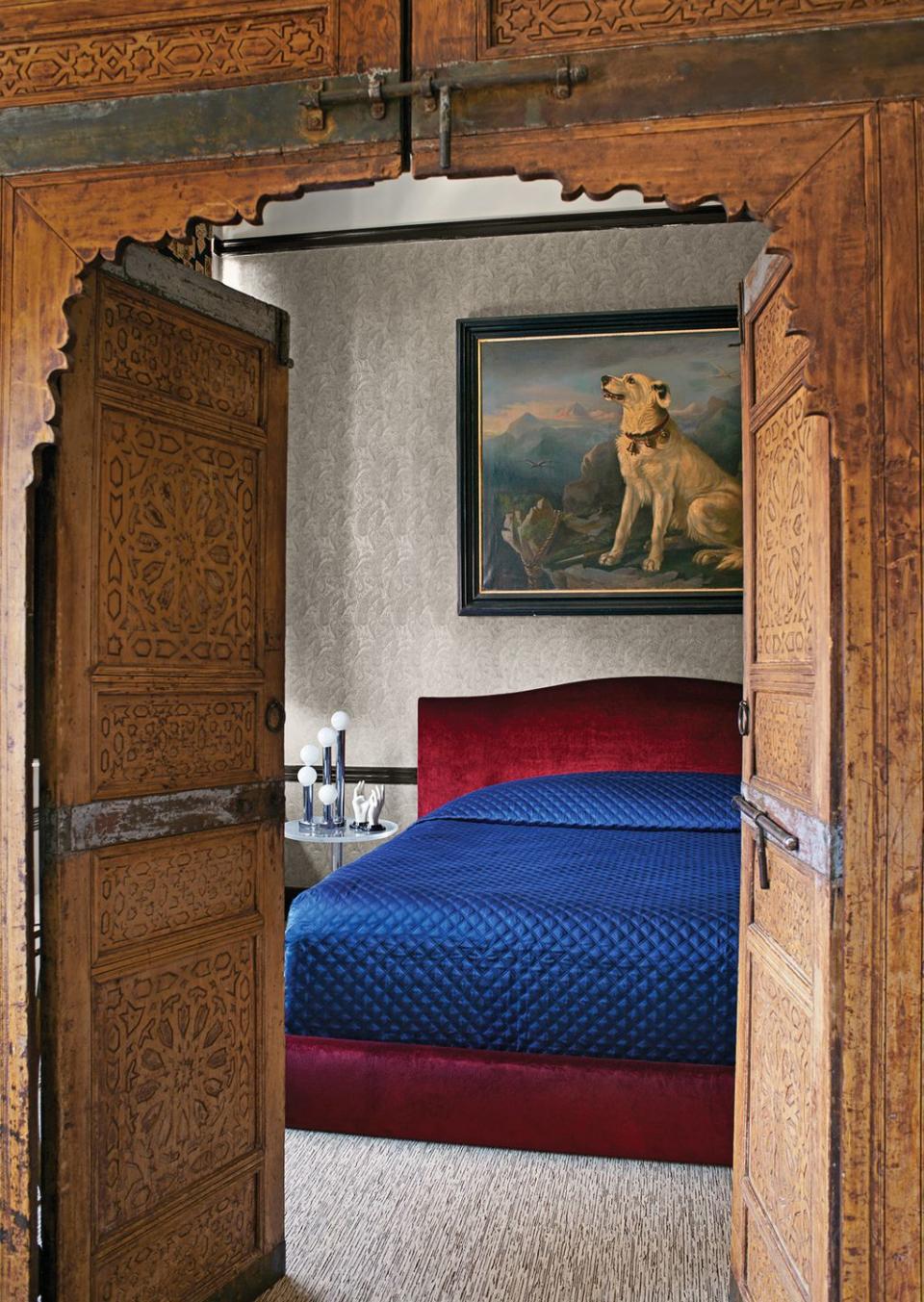 bedroom with carved wooden doors from indonesia