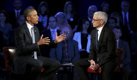 U.S. President Barack Obama participates in a live town hall event on reducing gun violence hosted by CNNâ€™s Anderson Cooper (R) at George Mason University in Fairfax, Virginia January 7, 2016. REUTERS/Kevin Lamarque