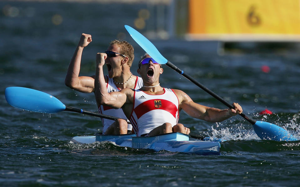 ATHENS - AUGUST 28: Ronald Rauhe and Tim Wieskoetter of Germany celebrate their victory in the men's K-2 class 500 metre final on August 28, 2004 during the Athens 2004 Summer Olympic Games at the Schinias Olympic Rowing and Canoeing Centre in Athens, Greece. (Photo by Jonathan Ferrey/Getty Images)