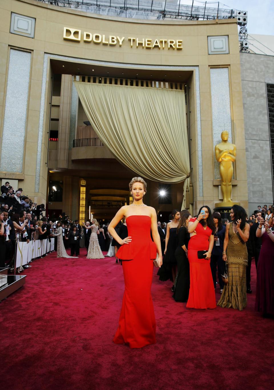 Jennifer Lawrence, best supporting actress nominee for her role in "American Hustle", arrives on the red carpet at the 86th Academy Awards in Hollywood, California March 2, 2014. REUTERS/Mike Blake (UNITED STATES TAGS: ENTERTAINMENT) (OSCARS-ARRIVALS)