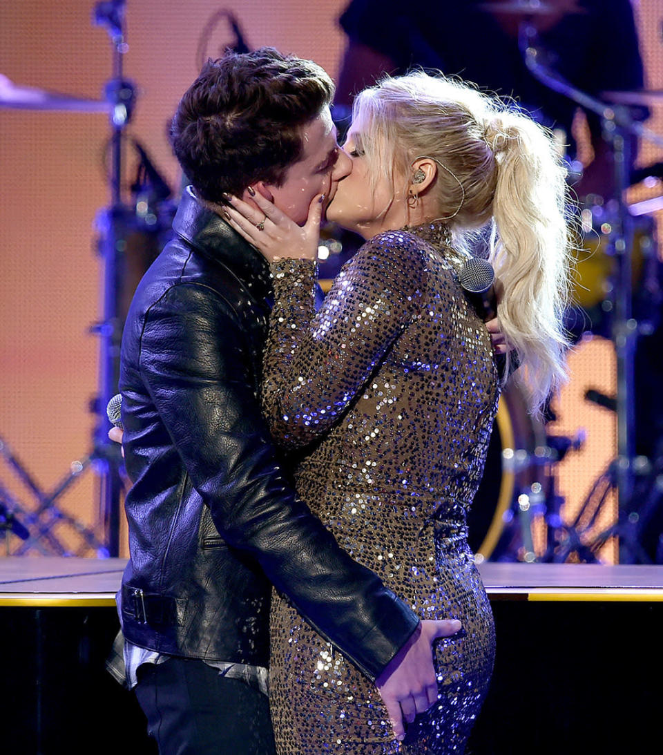 Charlie Puth and Meghan Trainor kiss onstage during the 2015 American Music Awards at Microsoft Theater on November 22, 2015 in Los Angeles.