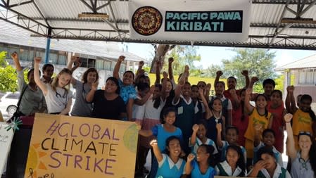 Students from various schools participate in a climate change protest in Tarawa