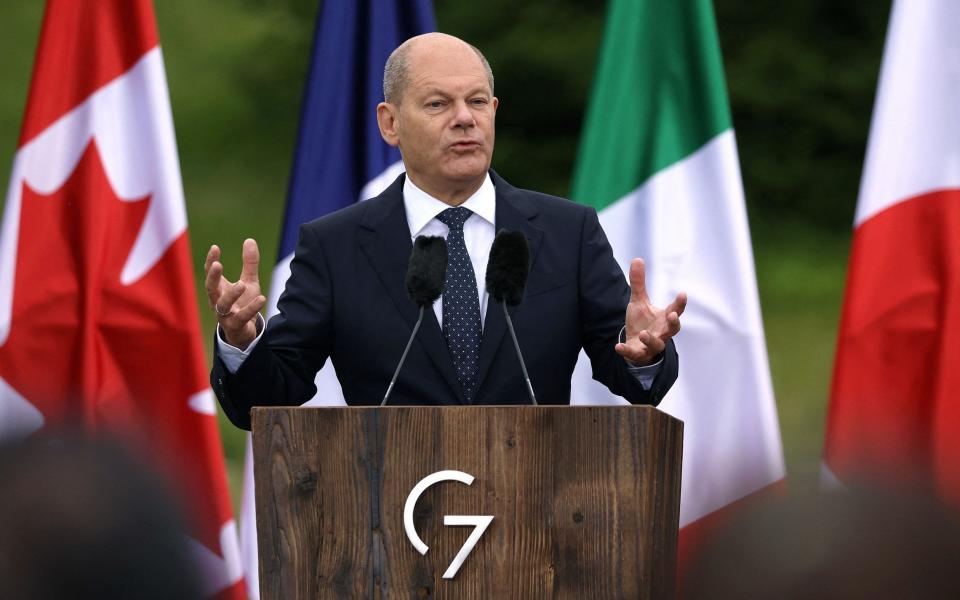 Olaf Scholz speaking at the end of the G7 summit. On Tuesday, the German chancellor vowed to become Europe's largest defence spender - Ronny Hartmann/AFP via Getty Images