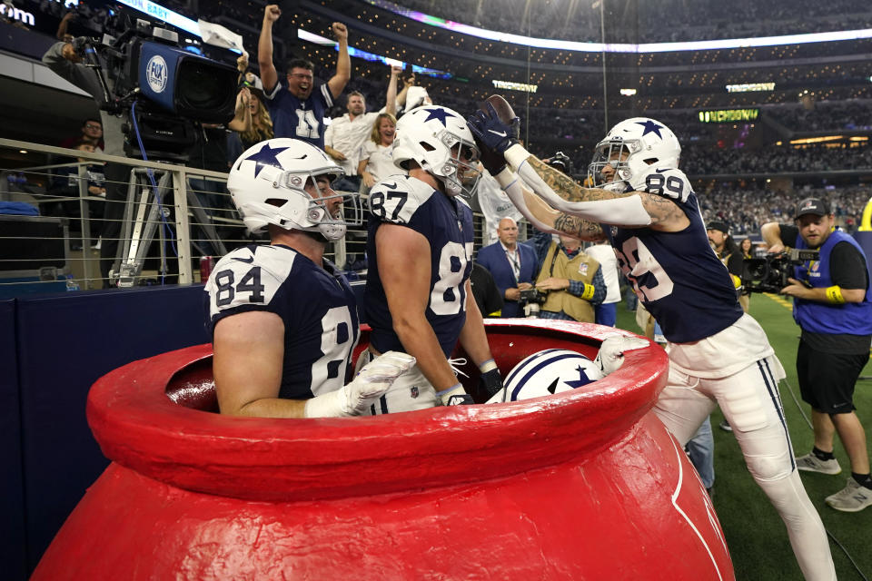 Dallas Cowboys' Peyton Hendershot (89) celebrates with Sean McKeon (84), Jake Ferguson (87) and Dalton Schultz after scoring a touchdown against the New York Giants during the second half of an NFL football game Thursday, Nov. 24, 2022, in Arlington, Texas. (AP Photo/Tony Gutierrez)