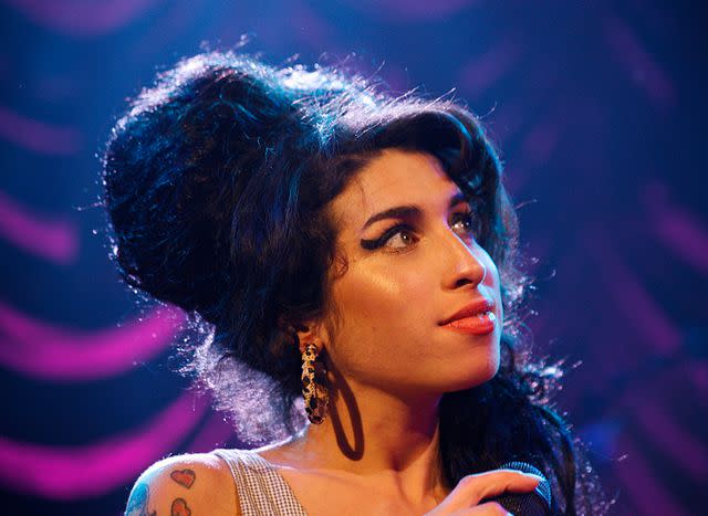 <p>Chris Christoforou/Redferns</p> Amy Winehouse performs in London