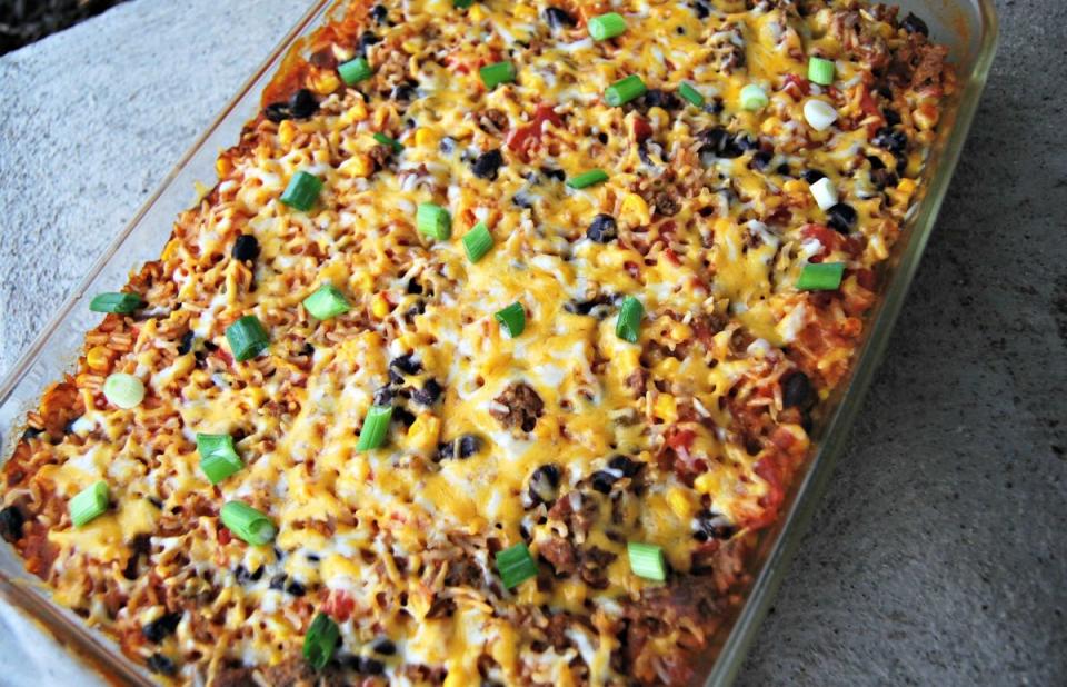 <p>Krista Marshall</p><p>This easy casserole brings the flavors of tacos, salsa and the side of rice all in one bite. </p><p><strong>Cost: $14.30</strong></p><p><strong>Get the recipe: <a href="https://parade.com/842668/kristamarshall/fiesta-taco-rice-bake/" rel="nofollow noopener" target="_blank" data-ylk="slk:Fiesta Taco Rice Bake;elm:context_link;itc:0;sec:content-canvas" class="link ">Fiesta Taco Rice Bake</a></strong></p>