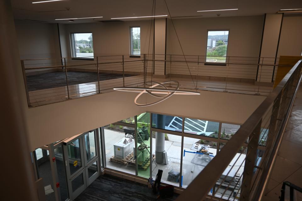 A chandelier hangs from the second floor of the Cayuga Park Medical Facility.
