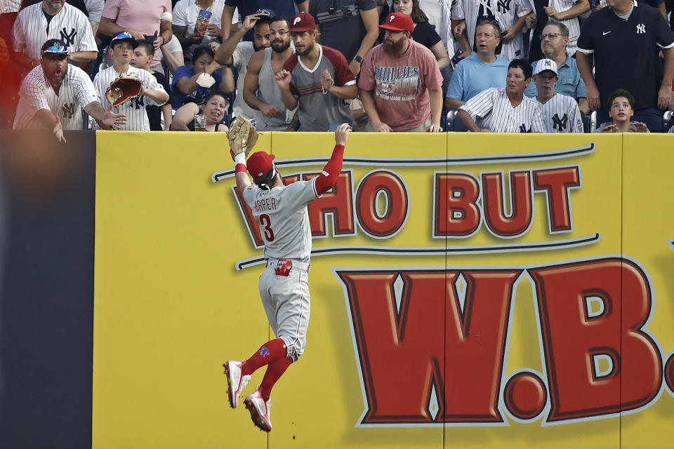 Philadelphia Phillies right fielder Bryce Harper can't make a play on a ball off the bat of New York Yankees' Greg Allen during the third inning of a baseball game on Tuesday, July 20, 2021, in New York. (AP Photo/Adam Hunger)