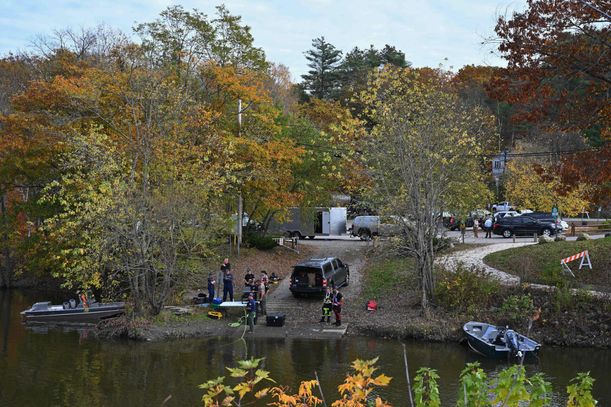 Law enforcement officials prepare to search the Androscoggin River in Lisbon Falls, Maine, on Oct. 27, 2023. (Angela Weiss / AFP - Getty Images)
