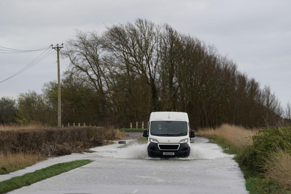 A van drives through flood water on Ferry Road in Littlehampton (Gareth Fuller/PA Wire)