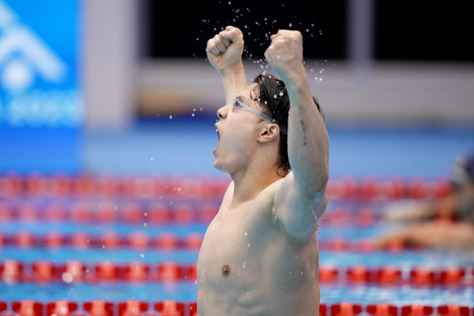 Qin Haiyang of China celebrates after winning the men's 200m breastroke final at the World Swimming Championships in Fukuoka, Japan, Friday, July 28, 2023. (AP Photo/Eugene Hoshiko)