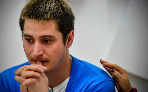 Maksim Lapunov, 30, gives a press conference in Moscow - Credit: ALEXANDER NEMENOV/AFP