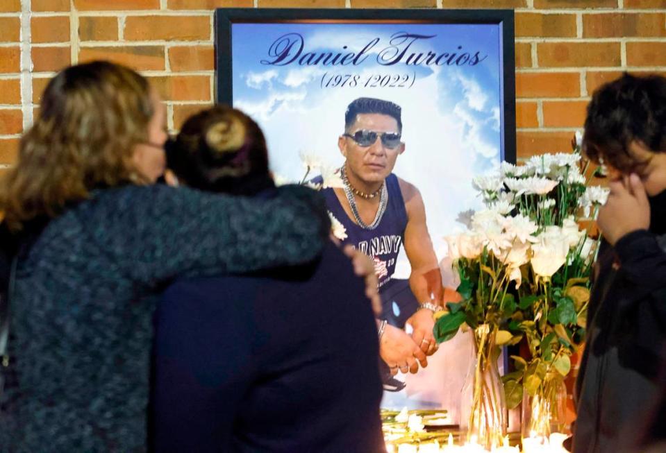 Rose Jerez, center, get a hug after a vigil for her husband Daniel Turcios in Raleigh, N.C. January 14, 2022. Turcios was fatally shot by Raleigh police Tuesday afternoon after a crash on Interstate 440.