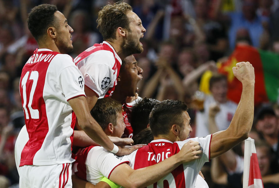 Ajax players celebrate scoring their first goal during a Group E Champions League soccer match between Ajax and AEK at the Johan Cruyff ArenA in Amsterdam, Netherlands, Wednesday, Sept. 19, 2018. (AP Photo/Peter Dejong)