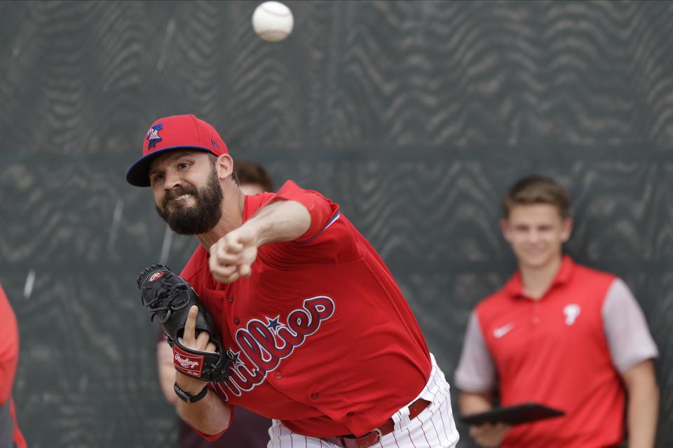 Philadelphia Phillies' Adam Morgan delivers a pitch during a spring training baseball workout Wednesday, Feb. 19, 2020, in Clearwater, Fla. (AP Photo/Frank Franklin II)