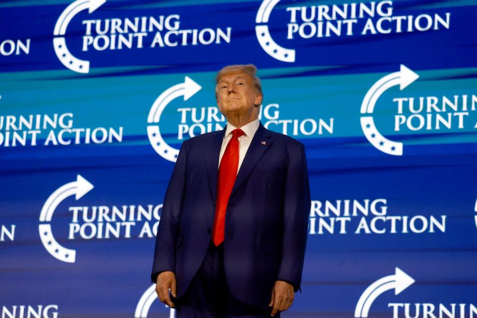 Former US President Donald Trump arrives on stage to speak at the Turning Point Action conference as he continues his 2024 presidential campaign on July 15, 2023 in West Palm Beach, Florida. (Getty Images)