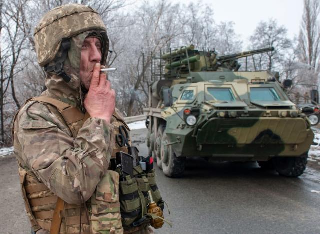 <div class="inline-image__caption"><p>A Ukrainian soldier smokes a cigarette on his position at an armored vehicle outside Kharkiv, Ukraine, Saturday, Feb. 26, 2022. President Volodymyr Zelenskyy claimed Saturday that Ukraine's forces had repulsed the assault and vowed to keep fighting. "We will win," Zelenskyy said.</p></div> <div class="inline-image__credit">AP Photo/Andrew Marienko </div>